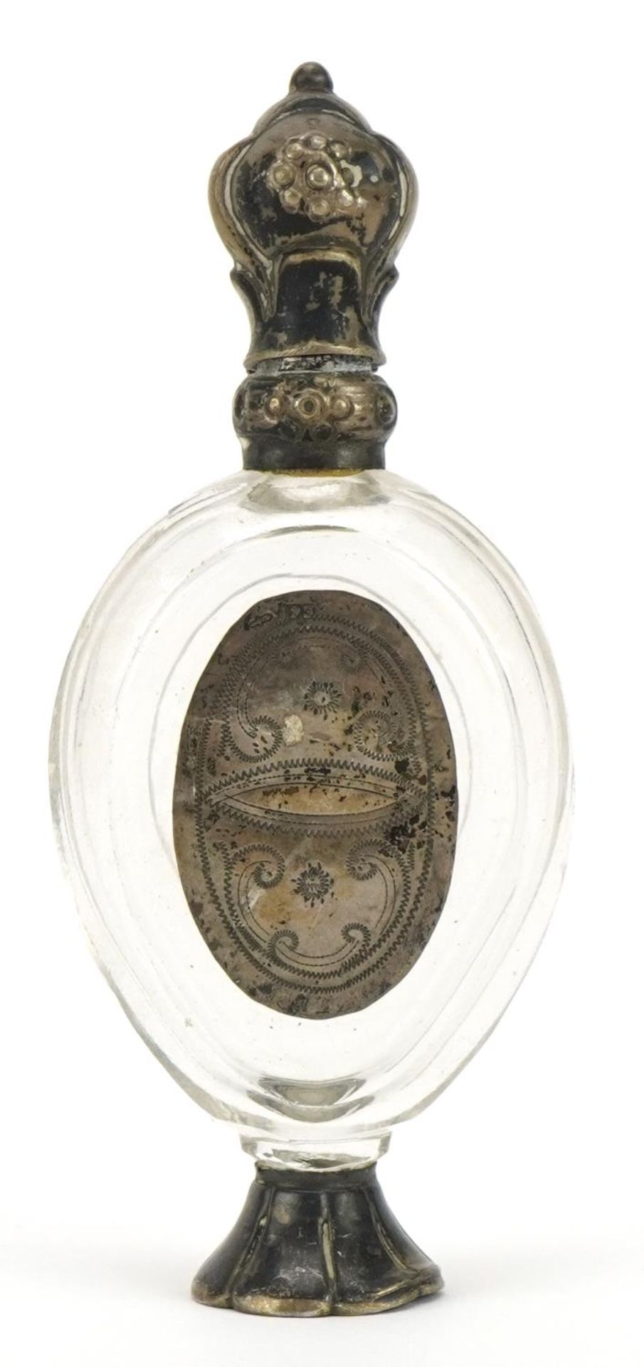 Antique cut glass scent bottle with stopper and unmarked silver mounts, 10.2cm high