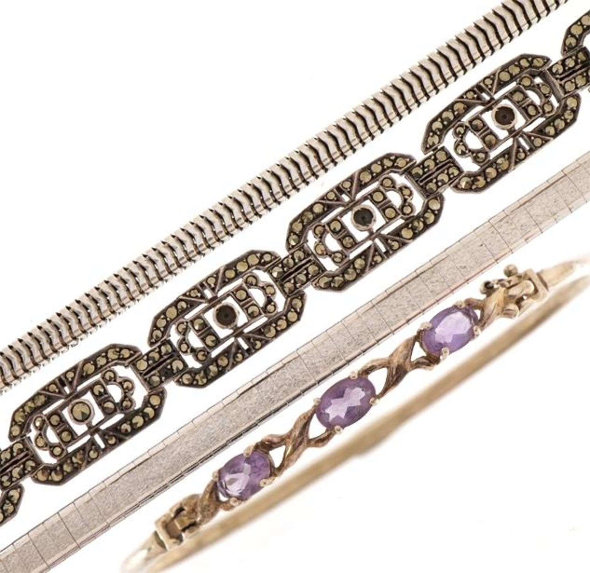 Silver jewllery comprising snake link necklace and three bracelets, one set with amethysts, total