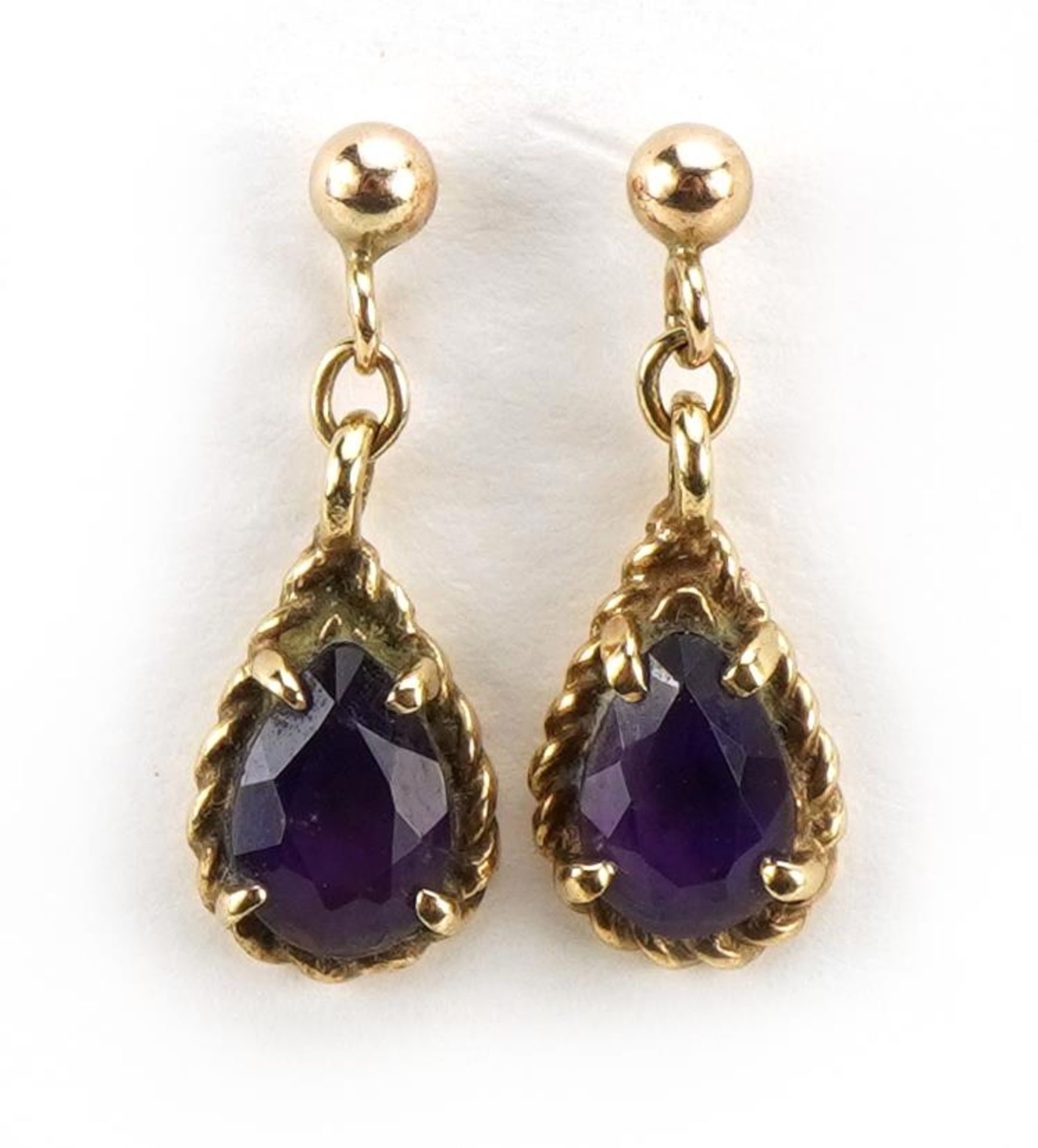 Pair of unmarked 9ct gold amethyst tear drop earrings, 1.6cm high, 1.3g