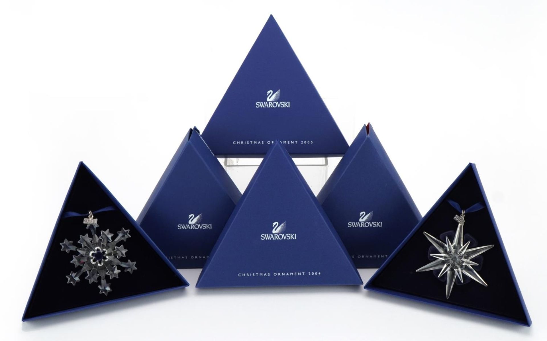 Two Swarovski Crystal Christmas ornaments with boxes comprising dates 2004 and 2005