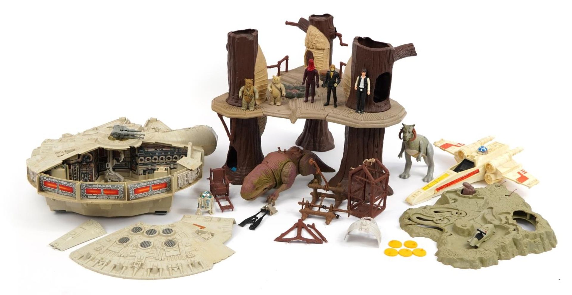 Vintage Star Wars toys comprising Millennium Falcon, Ewoks Village, Dewback and X-Wing Fighter