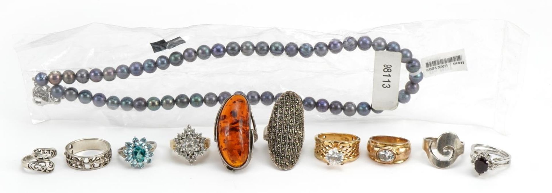 Silver and white metal jewellery including natural amber ring, pearl necklace and two way swivelling