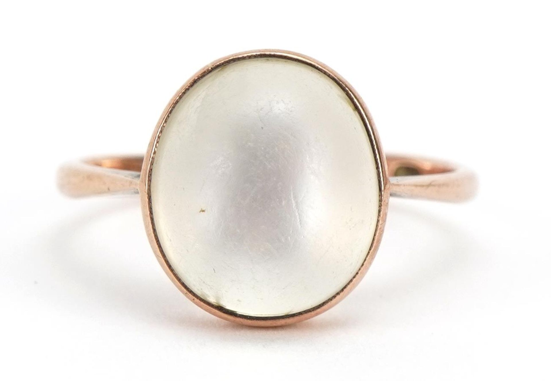 9ct rose gold cabochon moonstone ring, the stone approximately 11.4mm x 9.9mm, size P, 2.7g