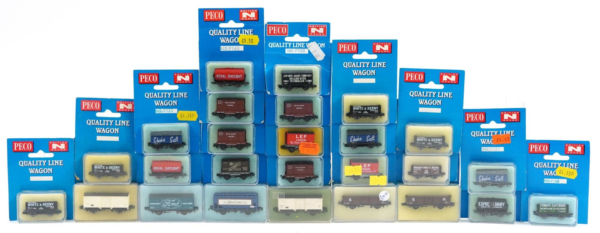 Twenty six Peco N gauge model railway wagons with cases