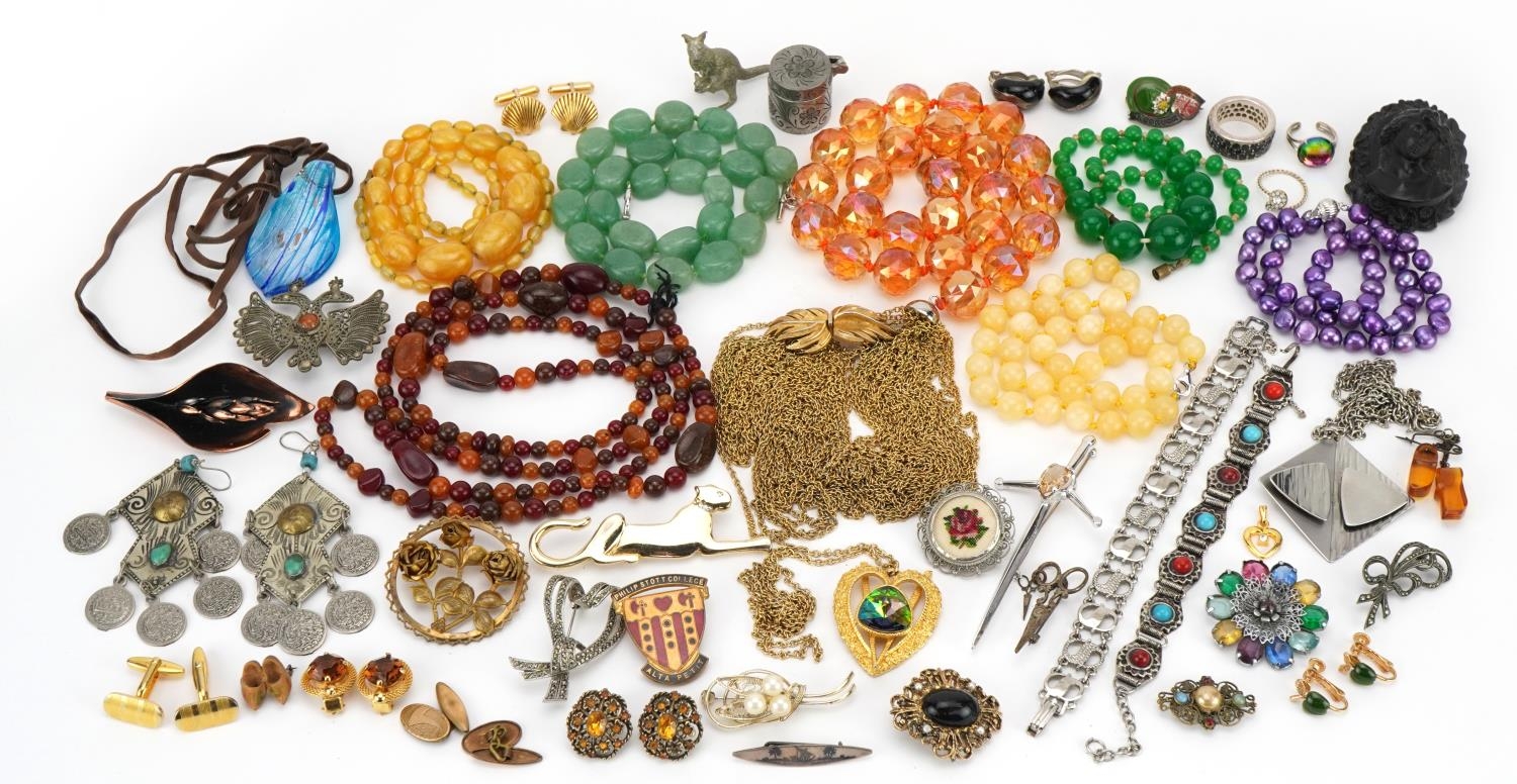 Vintage and later costume jewellery including a Trifari necklace, amber coloured bead necklaces,