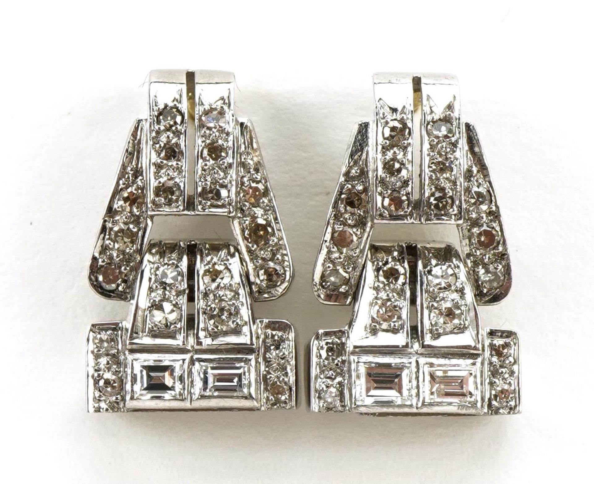 Pair of Art Deco unmarked white and yellow gold drop earrings set with baguette and round