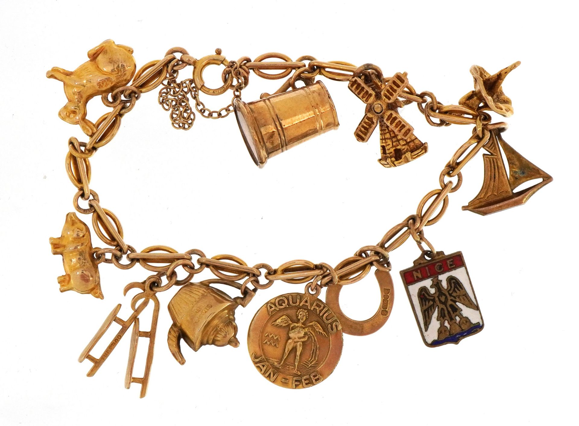 9ct gold charm bracelet with a selection of mostly gold charms, including ballerina, horseshoe and i