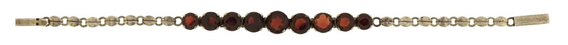 Antique unmarked silver bracelet set with nine garnets, 18.5cm in length, 8.6g - Image 2 of 3