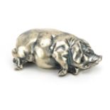 Silver model of a recumbent pig with ruby eyes, impressed Russian marks to the base, 7cm in