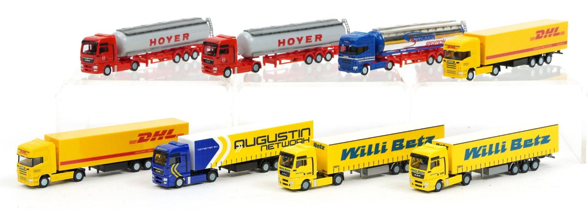 Eight Herpa N gauge model railway transport container lorries and tankers, housed in a protective