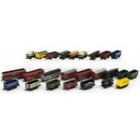 Twenty five N gauge model railway wagons, tankers and containers including Trix and Peco housed in a