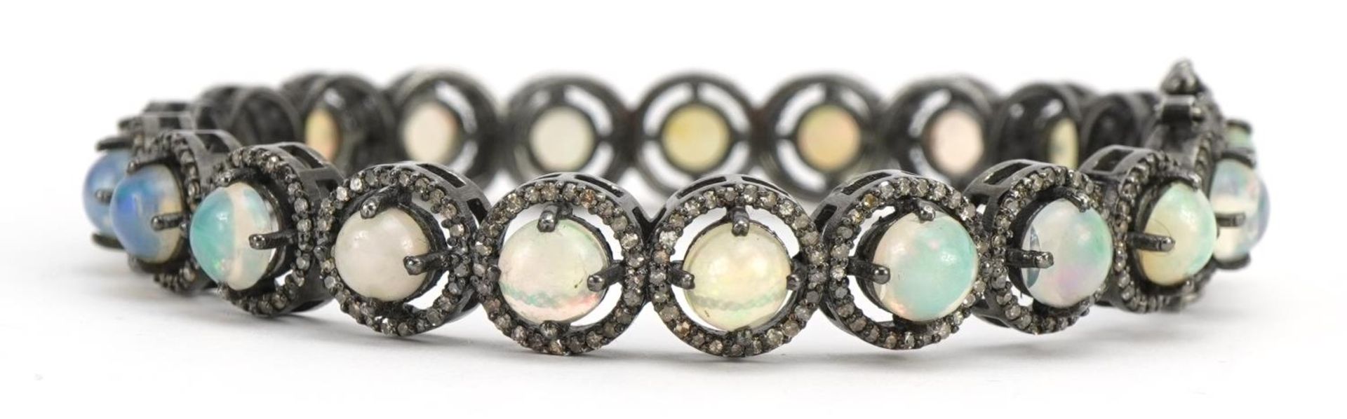 White metal cabochon opal and diamond hinged bracelet, 7.2cm in diameter, 23.7g - Image 2 of 2