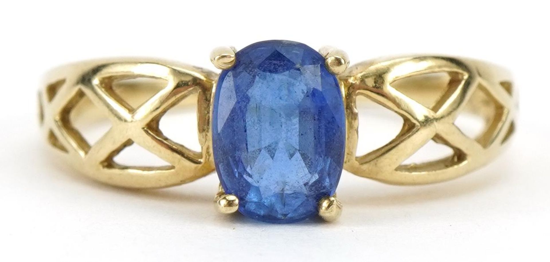 9ct gold tanzanite solitaire ring with Celtic design shoulders, the tanzanite approximately 7mm x