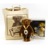 Two Steiff teddy bears with jointed limbs including music teddy bear with box, the largest 29cm high