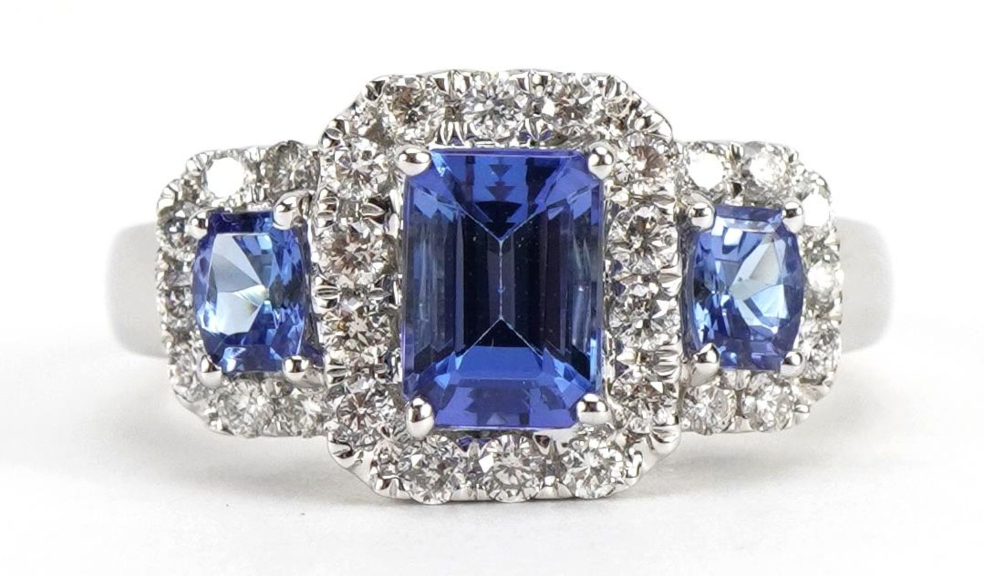 14k white gold tanzanite and diamond cluster ring, the largest stone approximately 6.8mm x 4.8mm,