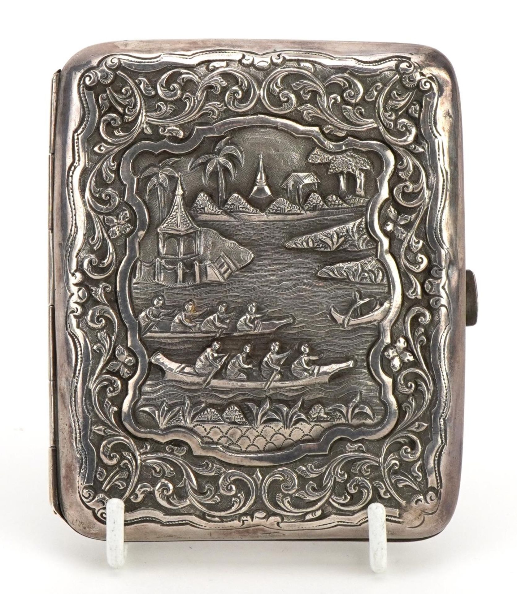 Unmarked Chinese rectangular silver cigarette case embossed with figures in rowing boats and