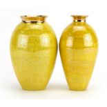 Atkinson Jones, two contemporary lustreware vases having yellow glazes, each 16.5cm high