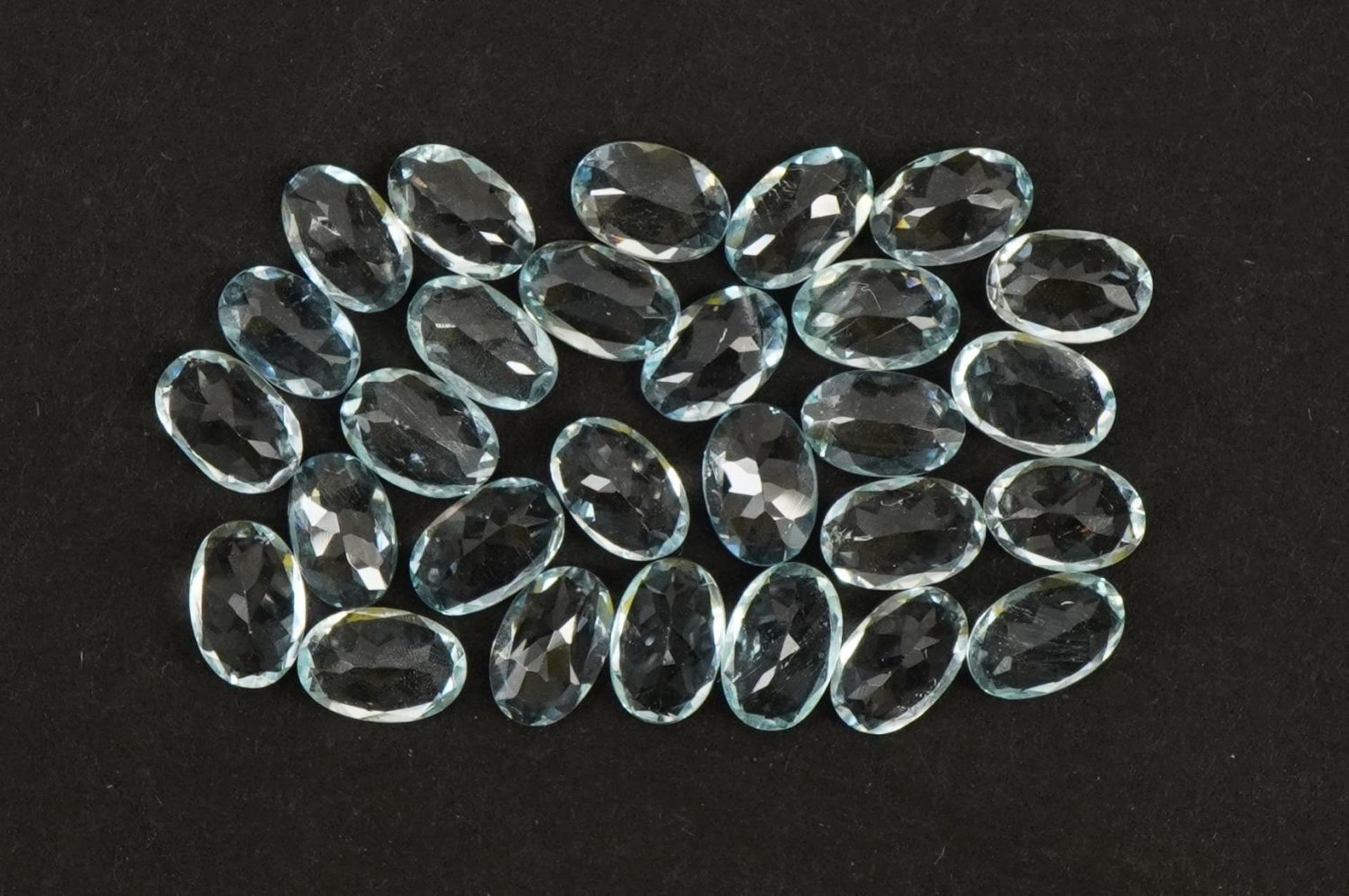 Twenty eight oval aquamarine gemstones, total 10.88 carat