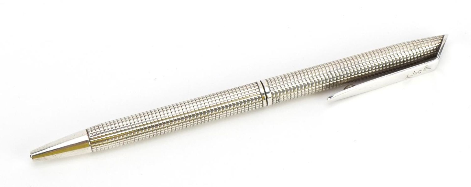 Silver ballpoint pen with engine turned body, 13.5cm in length