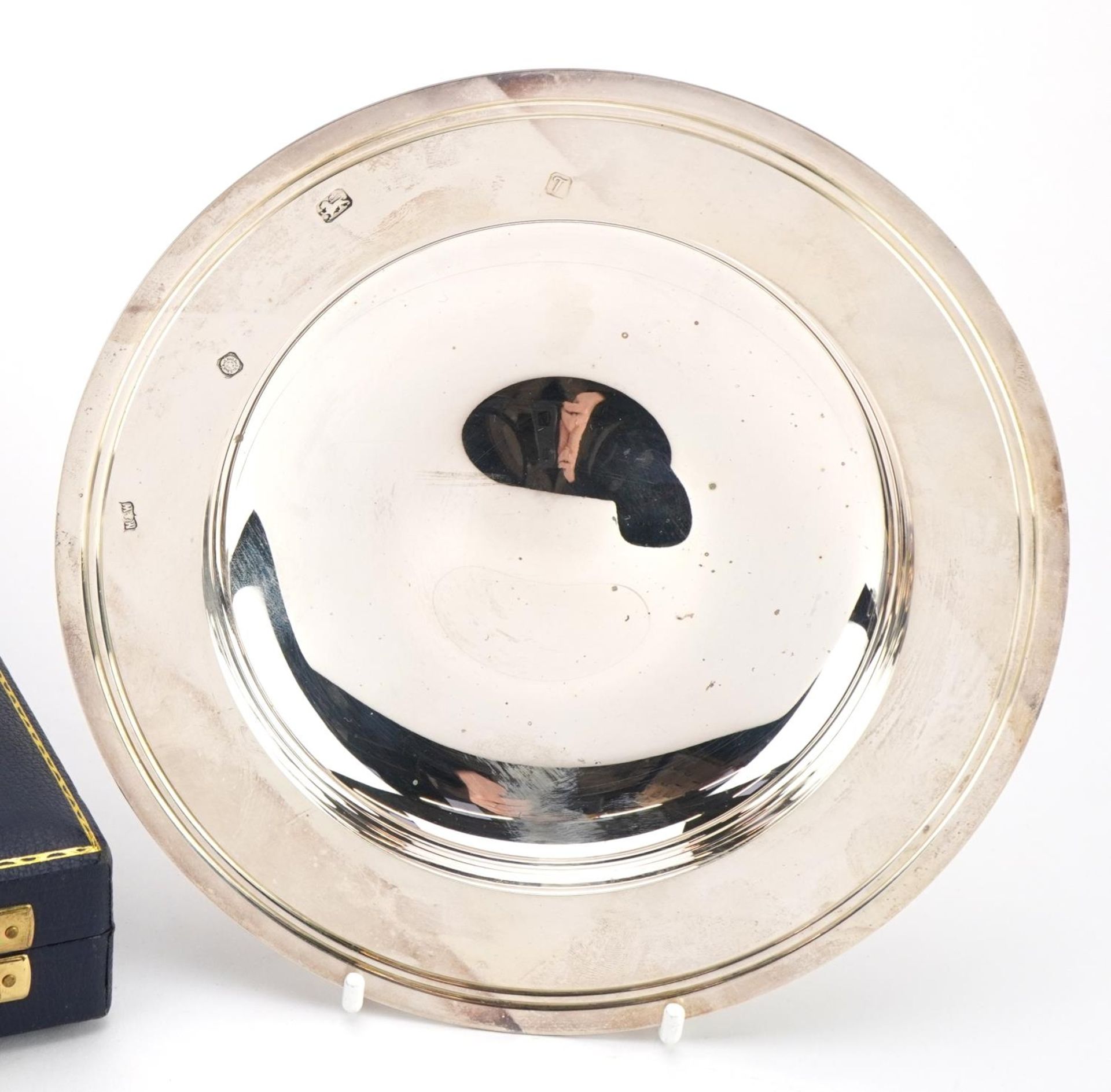 Mappin & Webb, Elizabeth II circular silver alms dish with velvet and silk lined fitted case, - Image 2 of 4