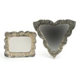 Two Turkish 900 grade silver backed mirrors embossed with flowers, the largest 16.5cm wide