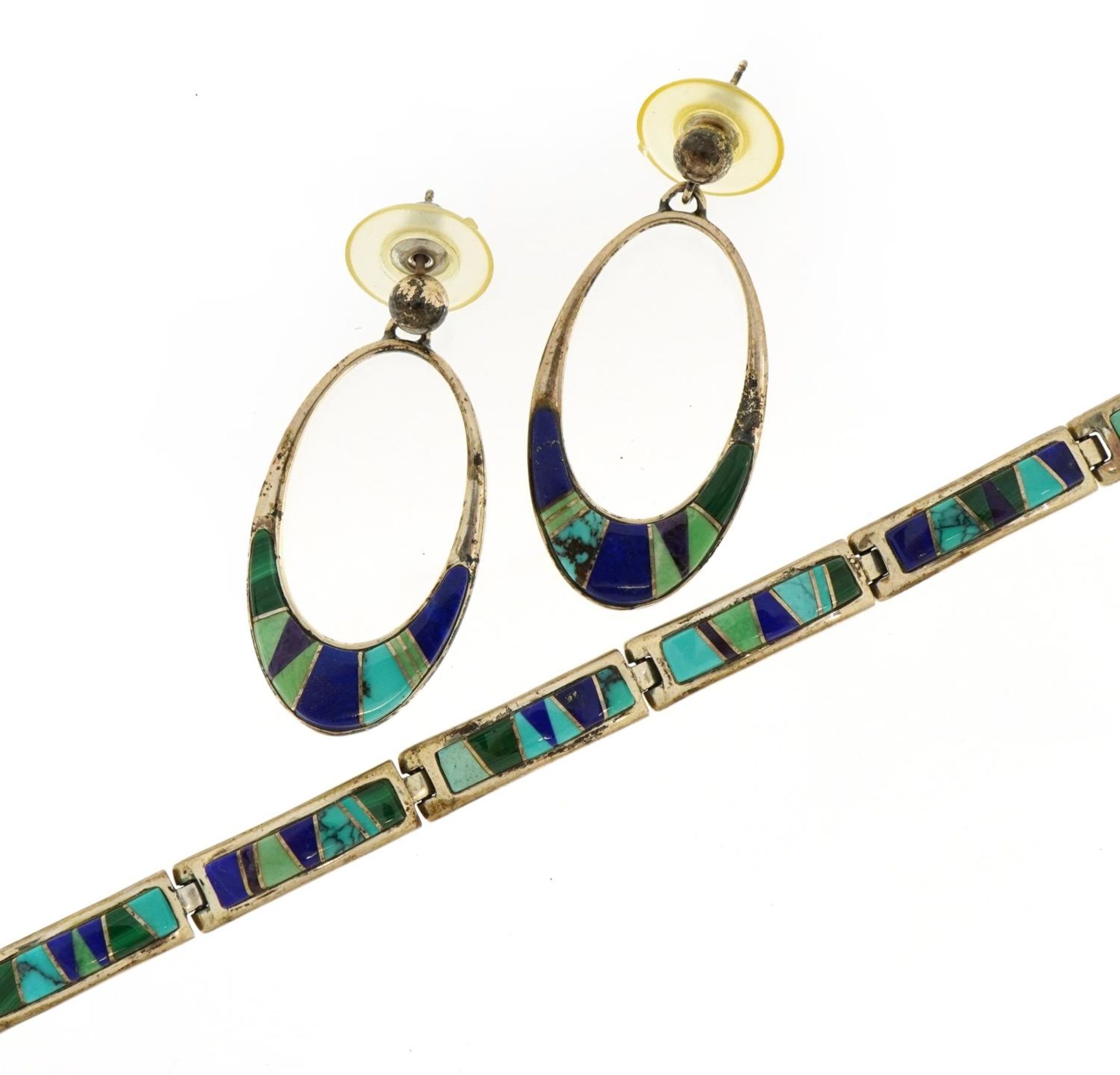 Navajo Calvin Dine sterling silver bracelet with matching earrings set with lapis lazuli,