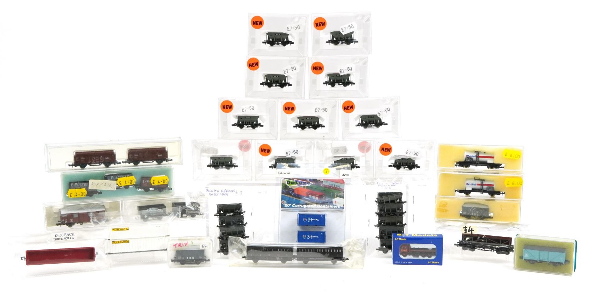 Collection of N gauge model railway carriages, wagons and tankers including Trix, Bachmann and Peco