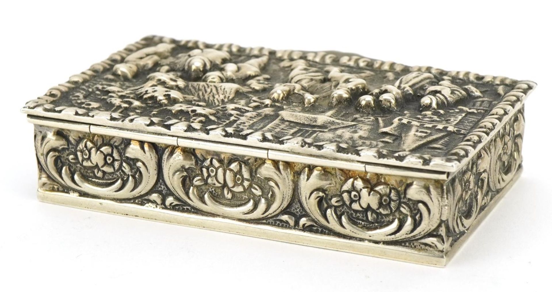 Dutch silver snuff box, the hinged lid embossed with merry figures, impressed marks to the base, 8cm - Image 2 of 4