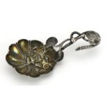 Victorian silver caddy spoon with naturalistic form, the bowl embossed with seashells, Birmingham