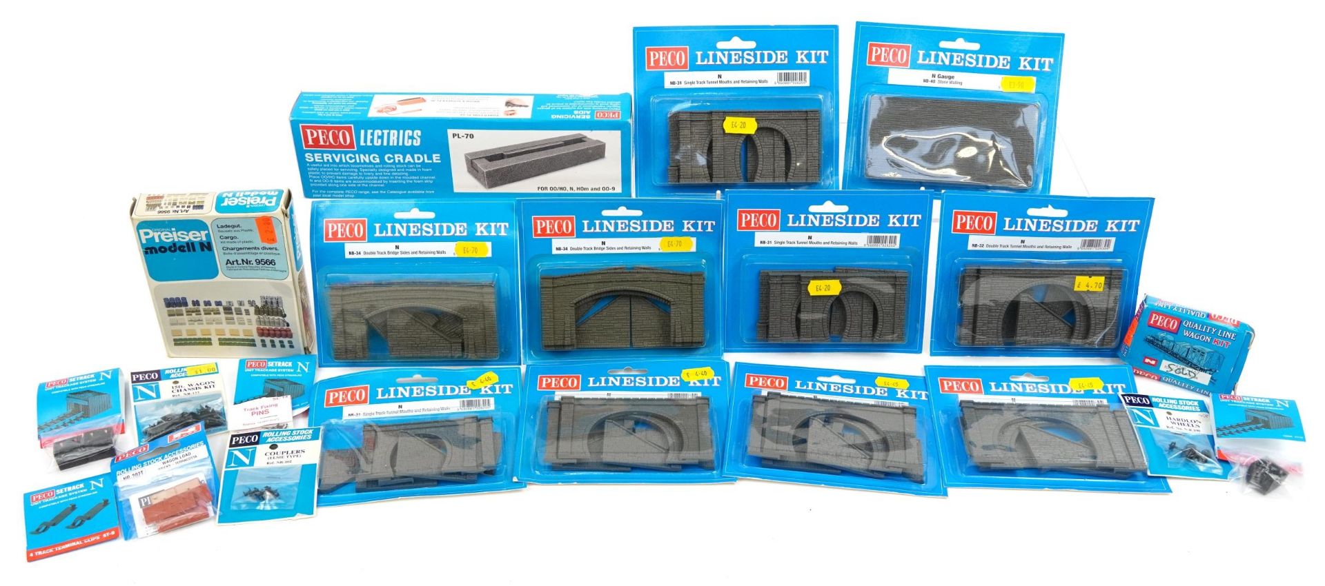 Collection of Peco N gauge model railway trackside accessories including tunnels, chassis kits and