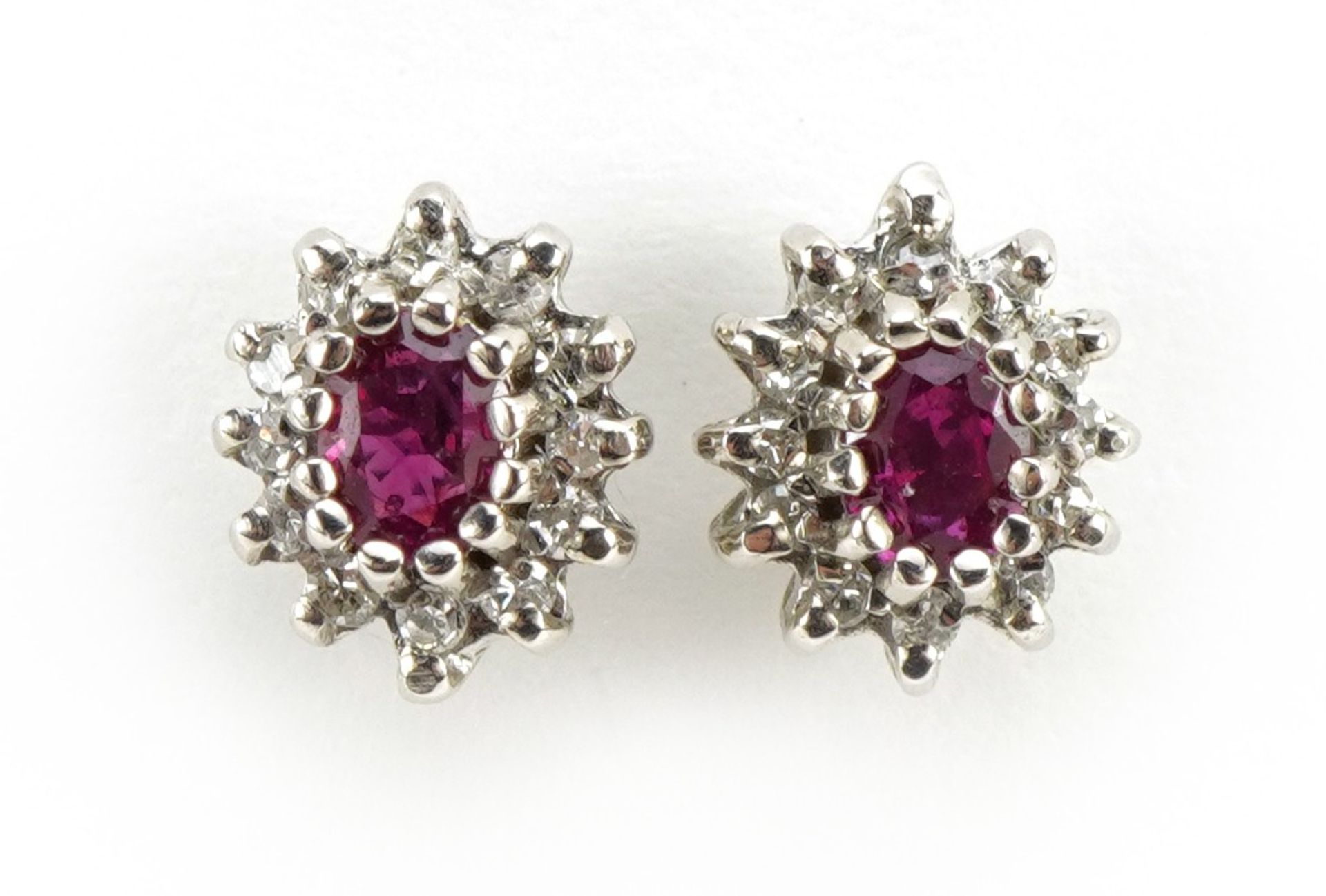 Pair of 9ct gold ruby and diamond cluster stud earrings, 8mm high, 1.7g