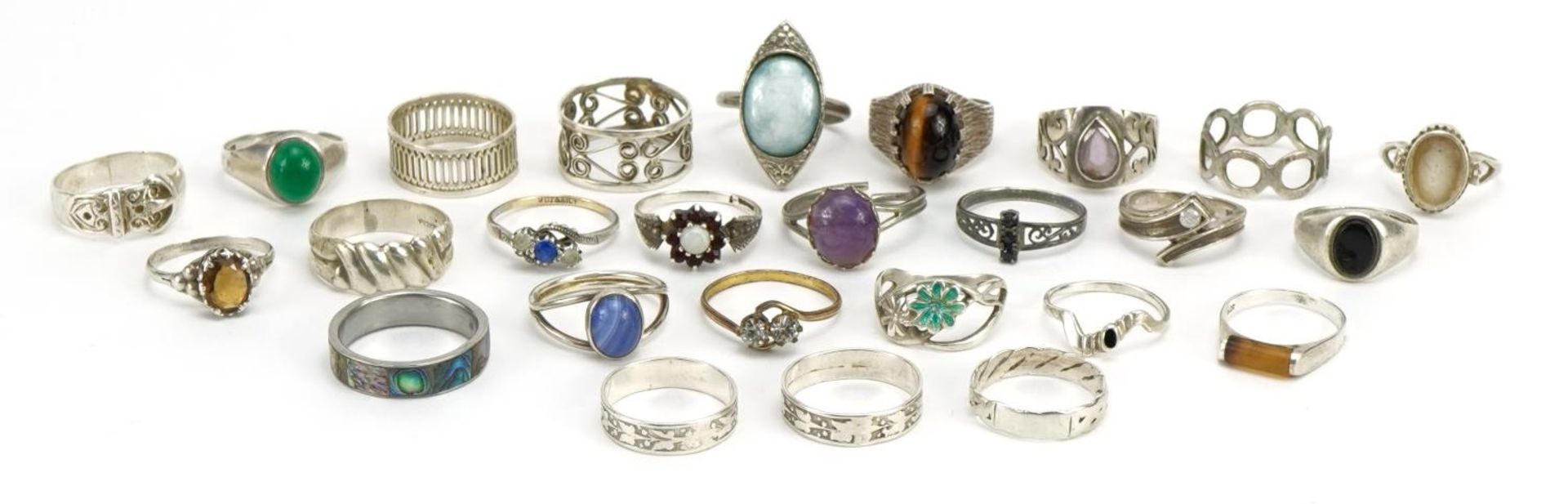 Twenty six silver and white metal rings, some set with cabochon stones, various sizes, total 70.4g