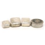 Four silver pill boxes with hinged lids, one with niello work decoration, the largest 3.4cm wide,