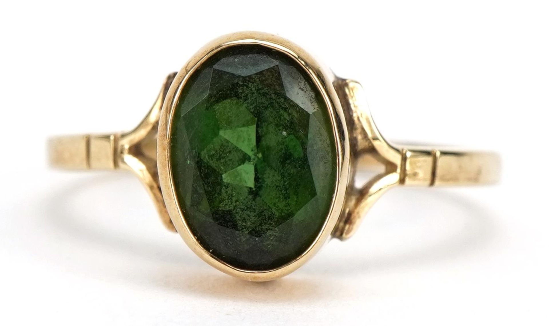 9ct gold green stone solitaire ring with split shoulders, probably olivine or tourmaline, size N,