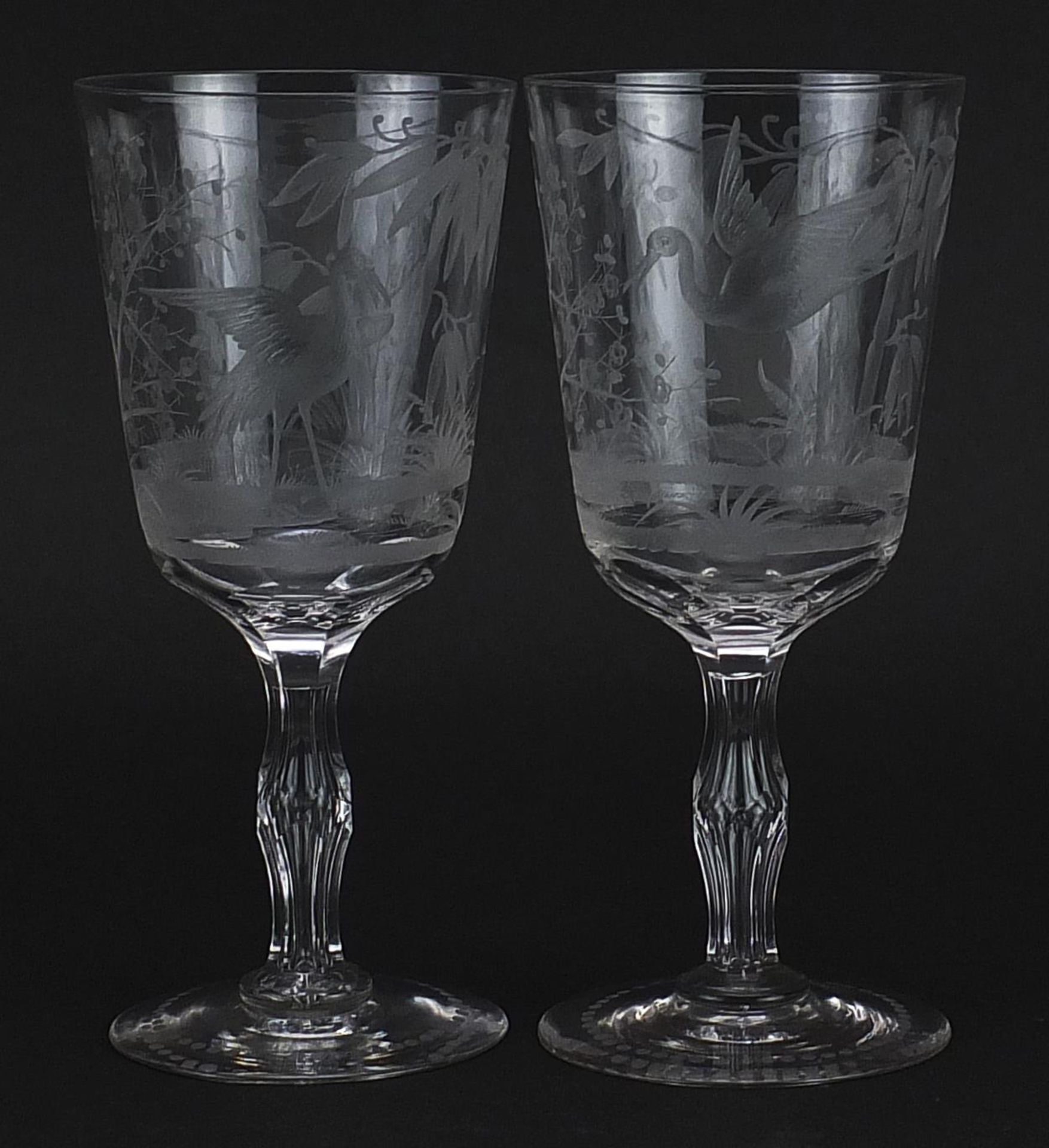 Pair of aesthetic style glasses etched with cranes amongst bamboo grove and cherry blossom, each