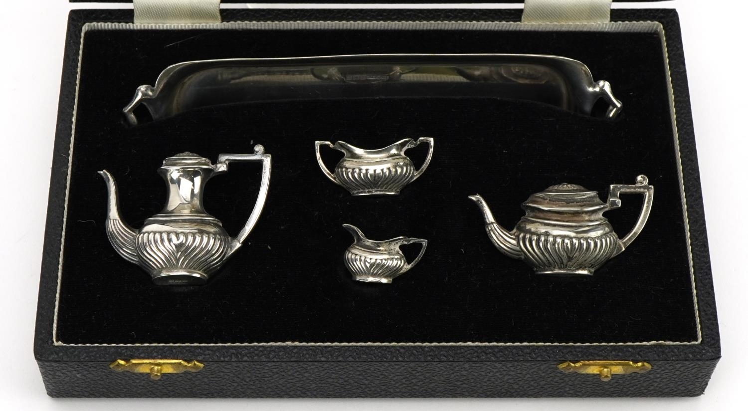 A Marston & Co, Elizabeth II silver five piece doll's house tea and coffee service housed in a - Image 2 of 4