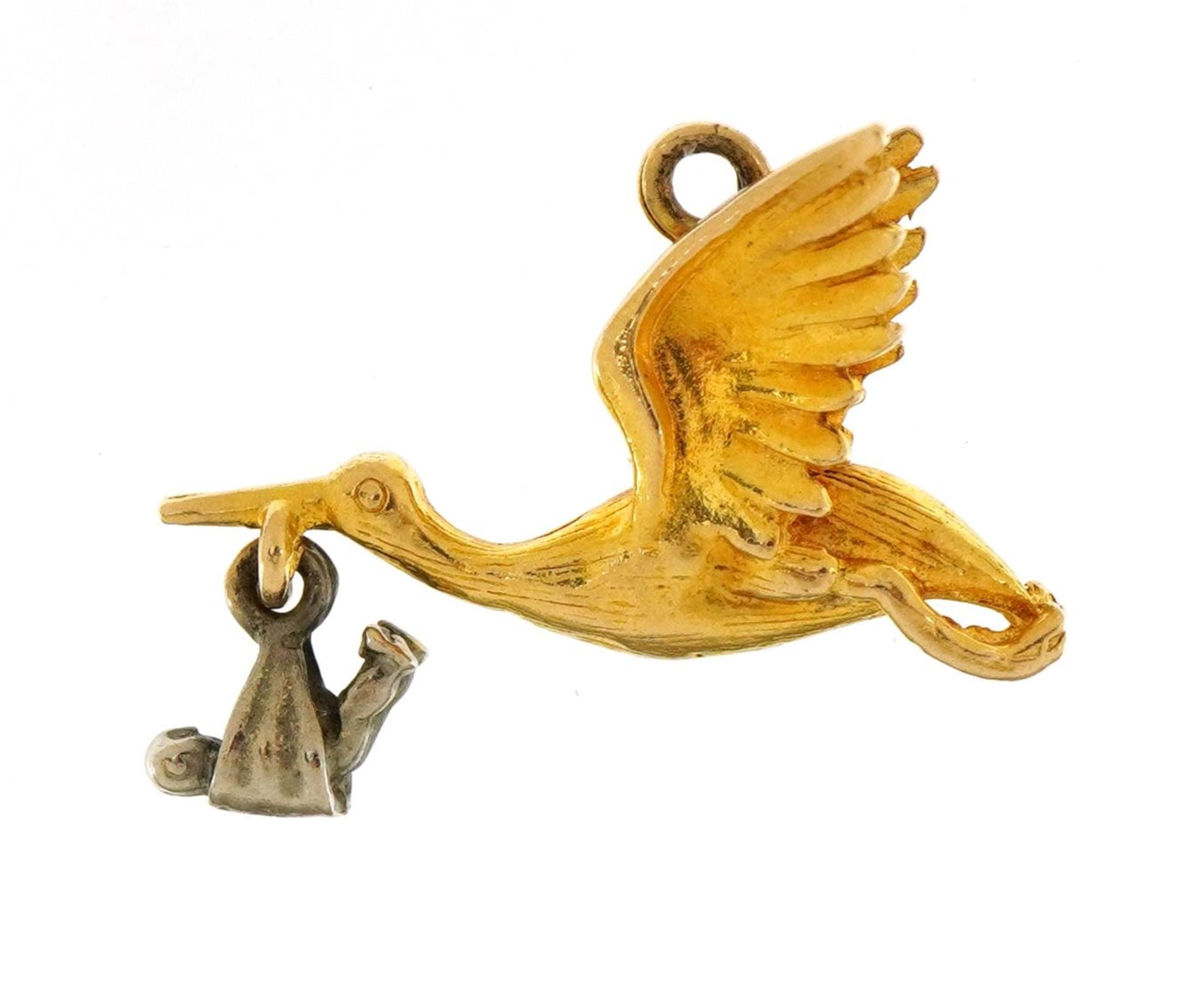 9ct wo tone gold stork and baby charm, 2.2cm wide, 2.6g