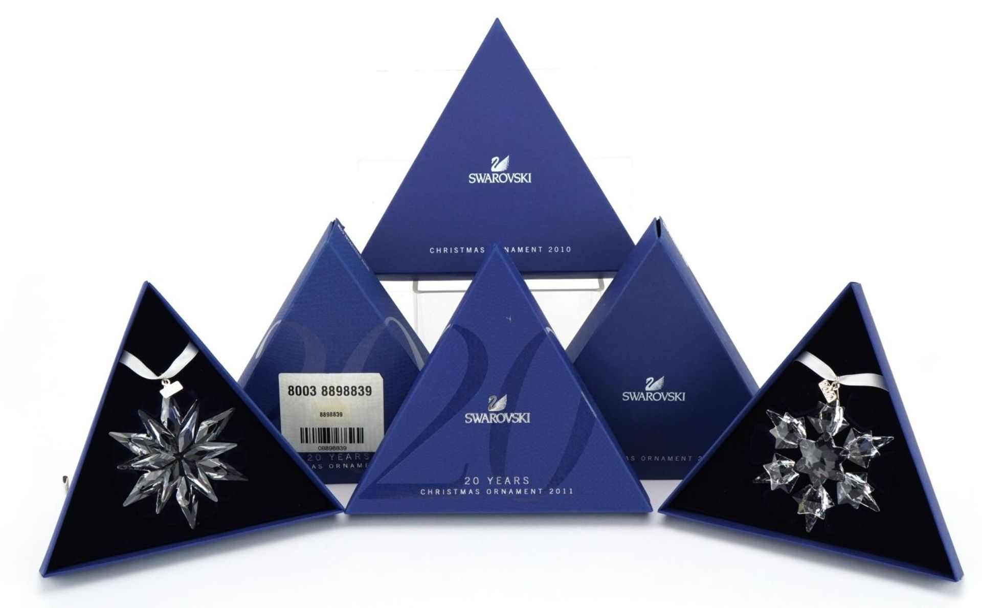 Two Swarovski Crystal Christmas ornaments with boxes comprising dates 2010 and 2011