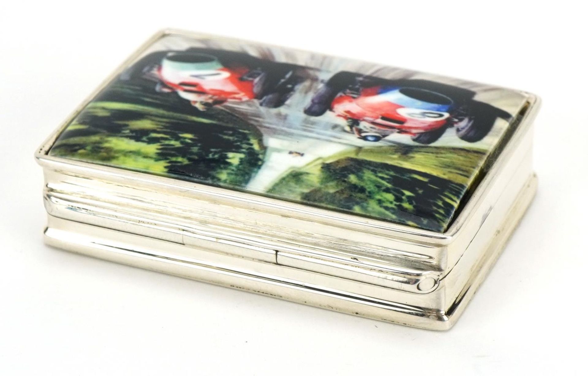 Rectangular silver and enamel pill box, the hinged lid decorated with Formula 1 cars, 5cm wide, 39. - Image 2 of 4