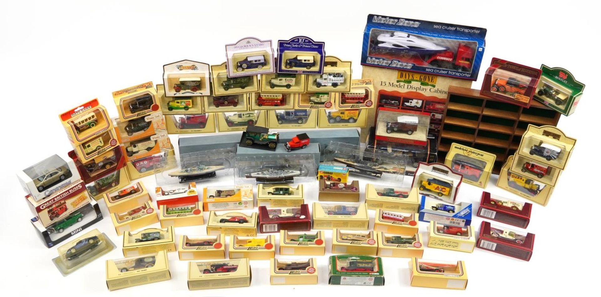 Collection of diecast advertising collector's vehicles and boats with boxes including Days Gone,