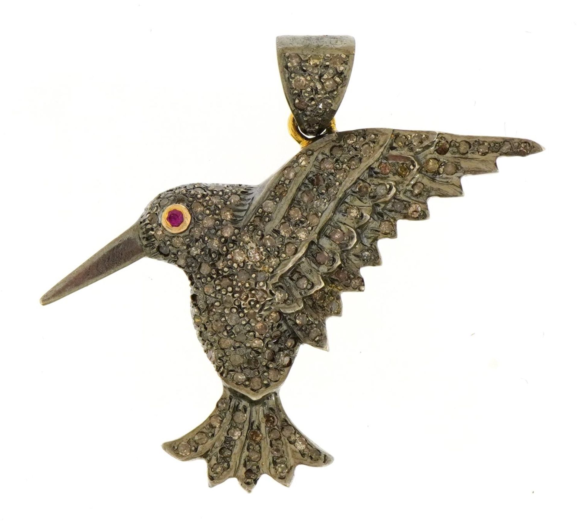 White and yellow metal diamond set bird pendant with ruby eye, 4.3cm high, 11.1g