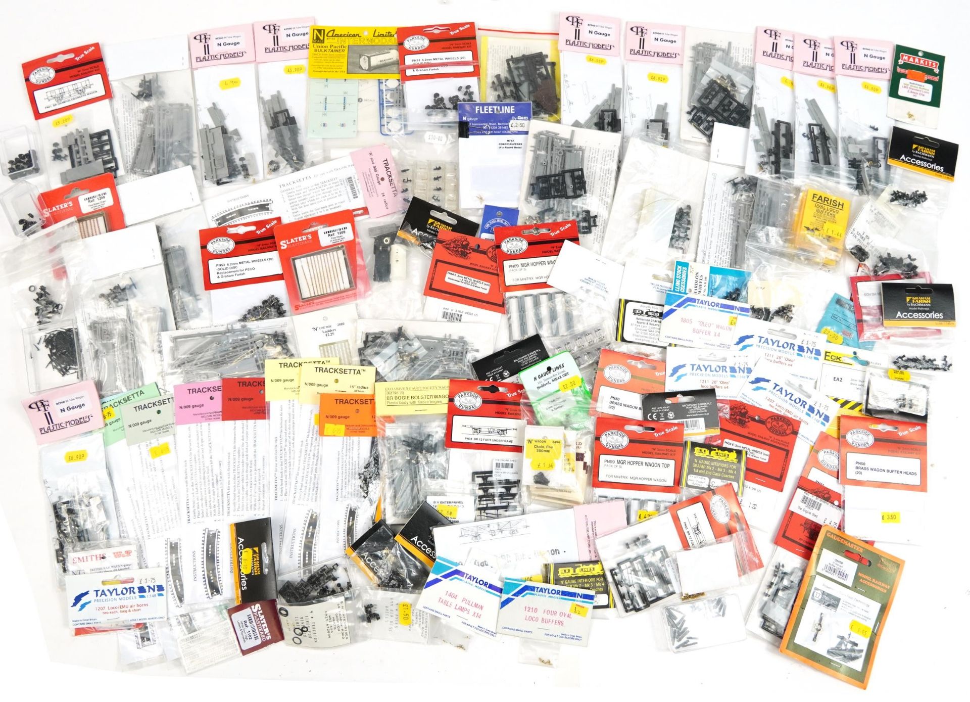 Large collection of N gauge model railway wagon kits and train accessories