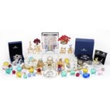 Collection of mostly Swarovski Crystal including miniature flowers raised on a stand, snowflake