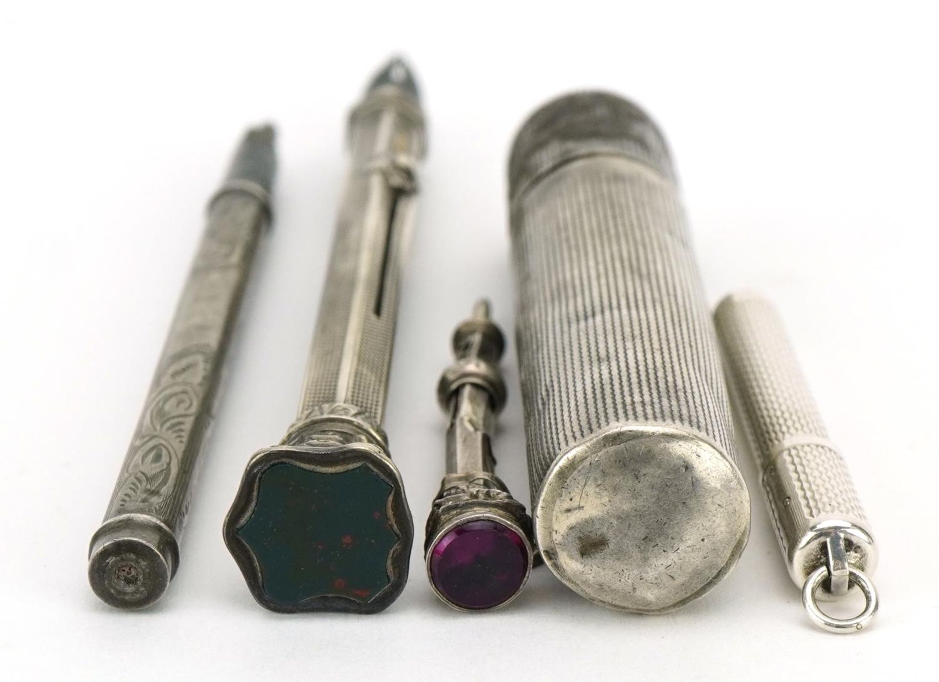 Four antique and later silver propelling pens and pencils and a sterling silver cased pocket lighter - Image 4 of 5