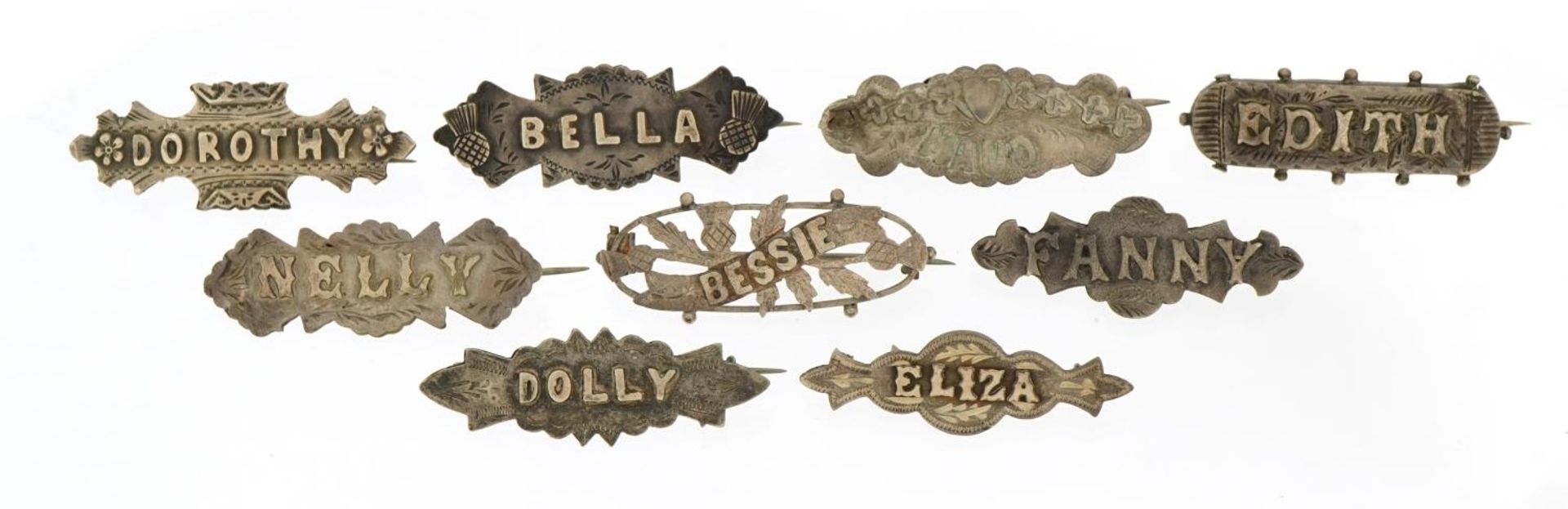 Nine Victorian silver name brooches including Edith, Dolly and Maud, the largest 4.5cm wide, total