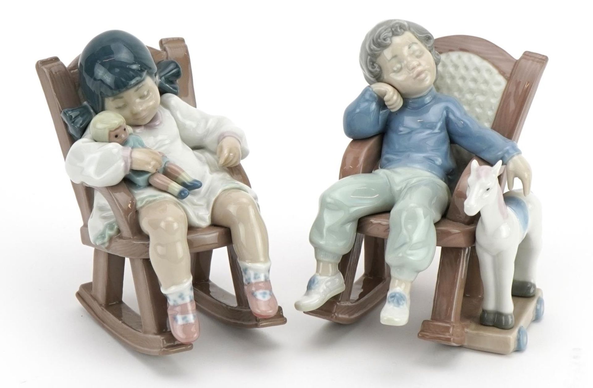 Two Lladro figures of children in rocking chairs comprising Nap Time 5448 and All Tuckered Out 5846