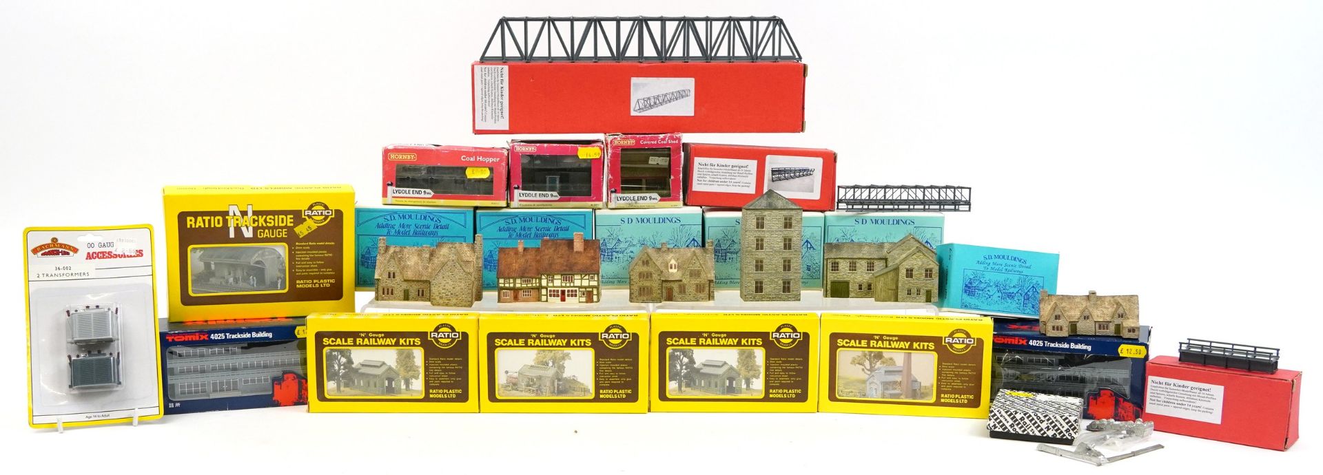 Collection of N gauge model railway trackside buildings and accessories including Ratio railway kits