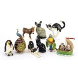 Nine novelty enamelled trinket boxes in the form of animals including cats, penguins and a donkey,