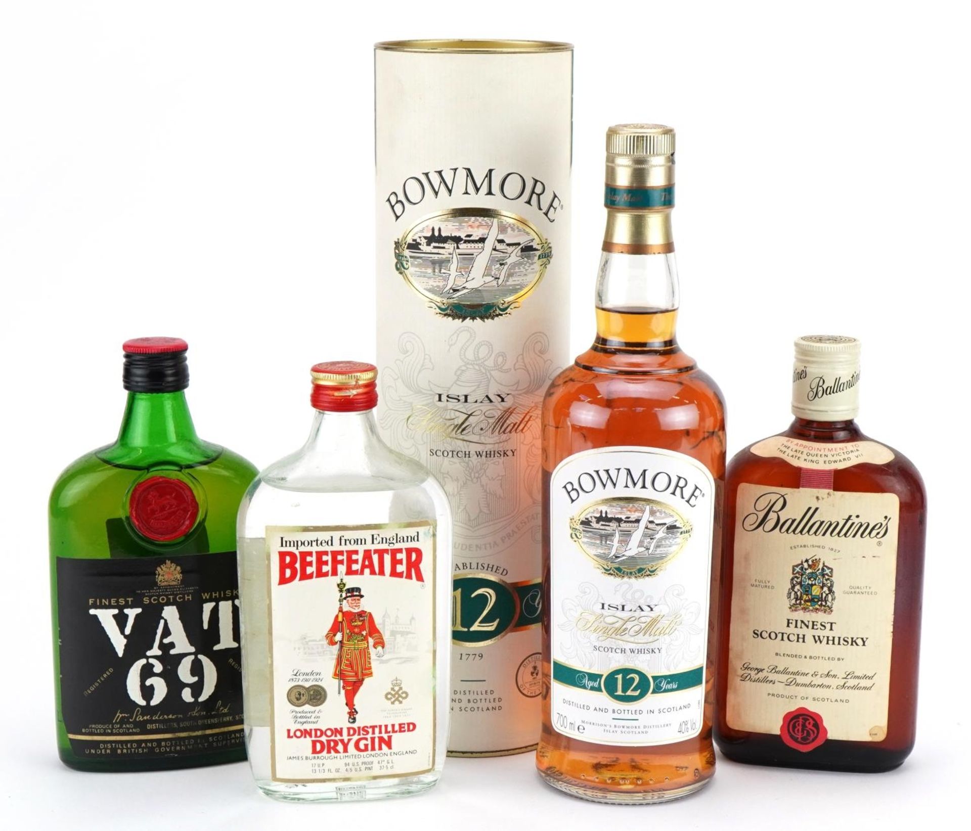 Four bottles of alcohol comprising Bowmore Single Malt whiskey aged 12 years with box, Ballantines