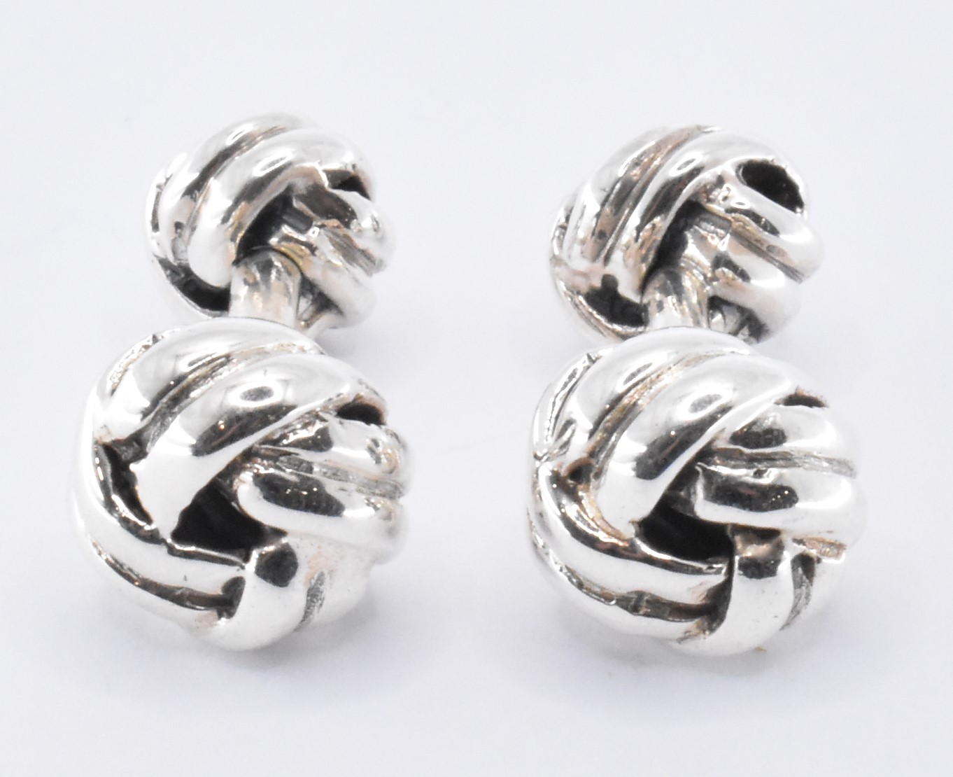 PAIR OF SILVER KNOT CUFFLINKS